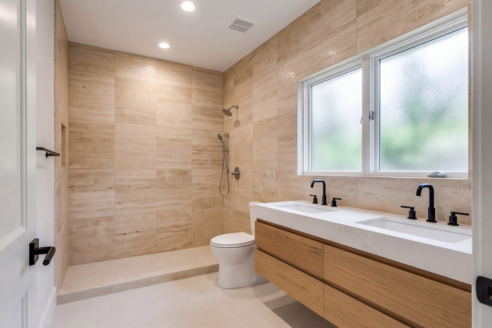 Highland Park primary bathroom with oak vanity, floor-to-ceiling tile and a large frosted window